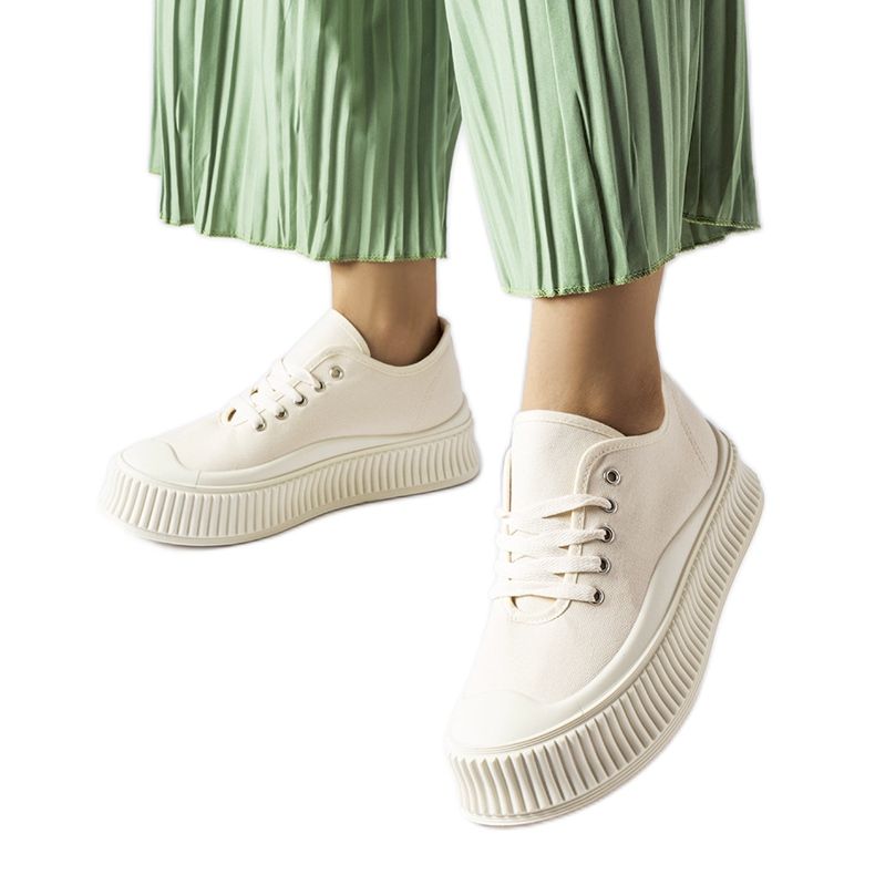 Beige sneakers on a thick Rina platform