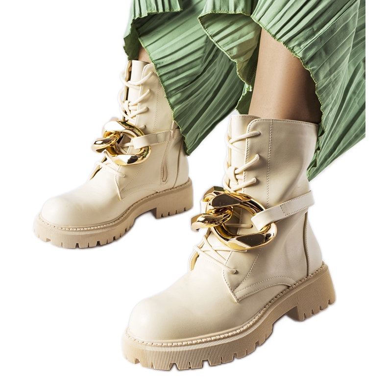Beige hiking boots with a Galar chain