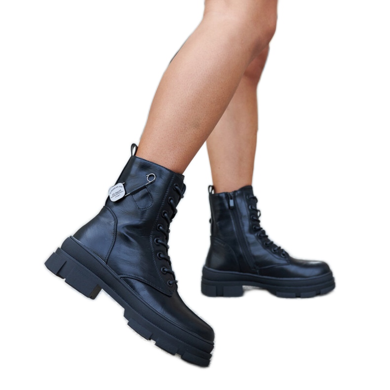 Inna Black insulated boots with Saavedra safety pin