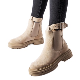 Beige ankle boots with a decorative clasp by Abela