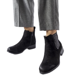 Black flat ankle boots with a decorative Arnoux insert