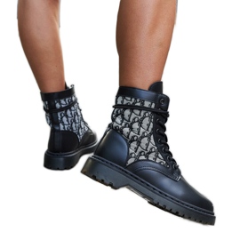 Black boots decorated with a monogram