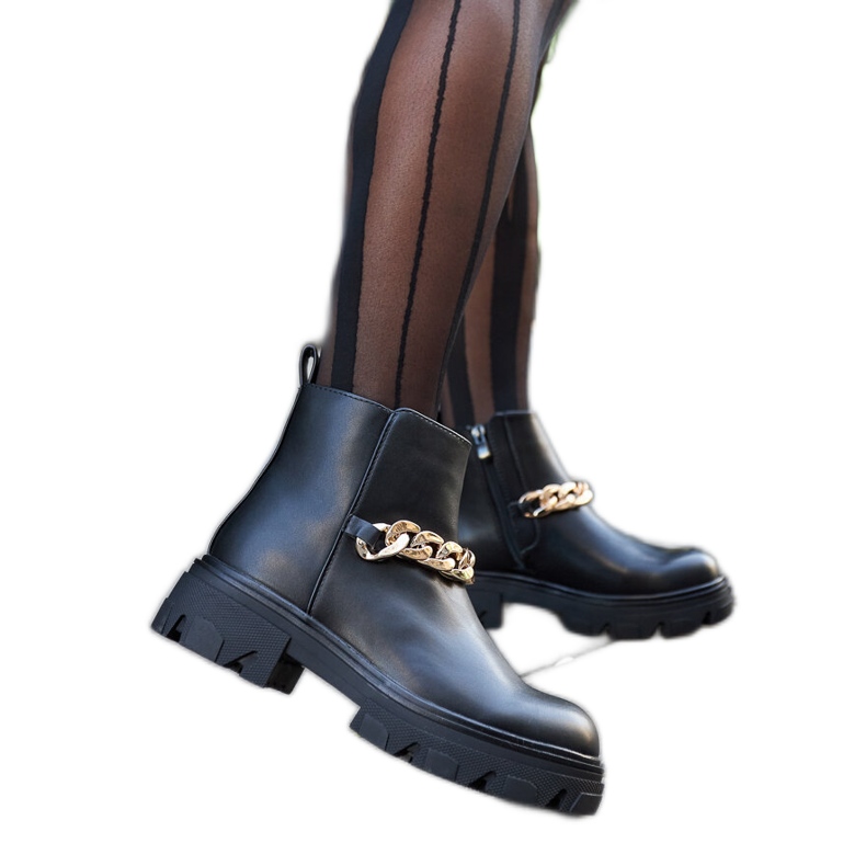 Black ankle boots with a decorative thick Alfie chain
