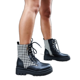 Black insulated ankle boots with a houndstooth pattern by Alfeo