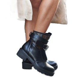 Black boots with a decorative Domus strap