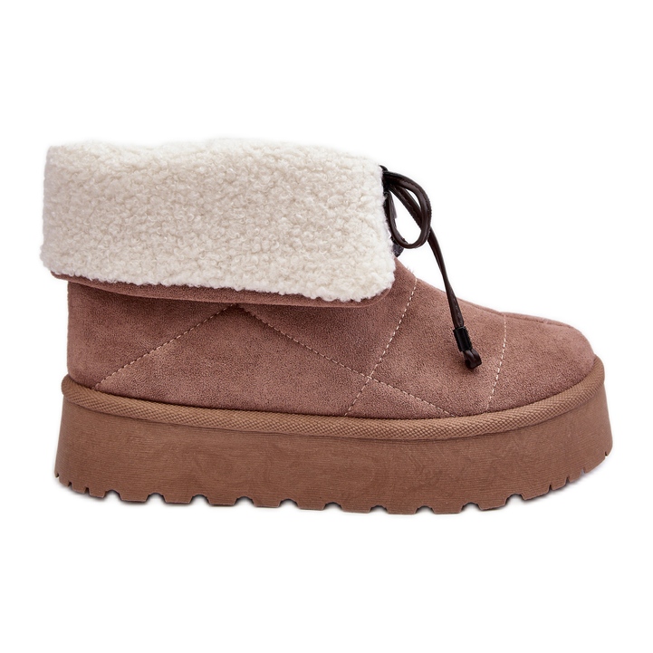 Beige Olimuka snow boots on a platform with a sheepskin coat
