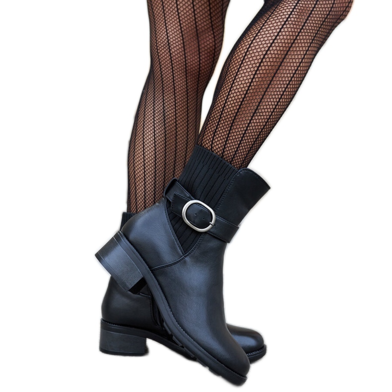 Black ankle boots with a decorative Archuleta buckle