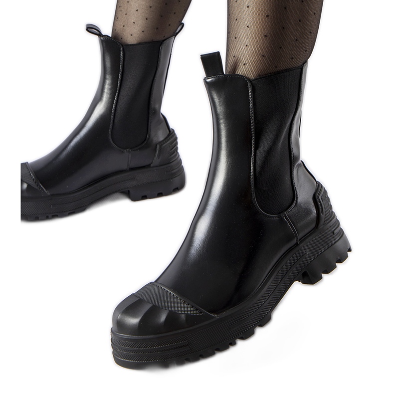 Black, insulated, massive Albanese ankle boots