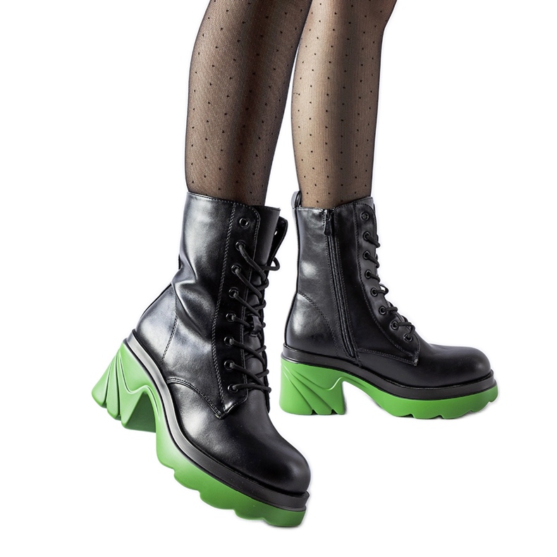 Black insulated shoes with a green Costa heel