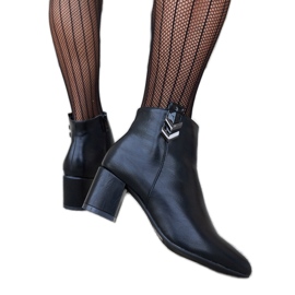 Black low-heeled ankle boots by Aniceto