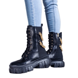 Black boots decorated with Crocemosso chains
