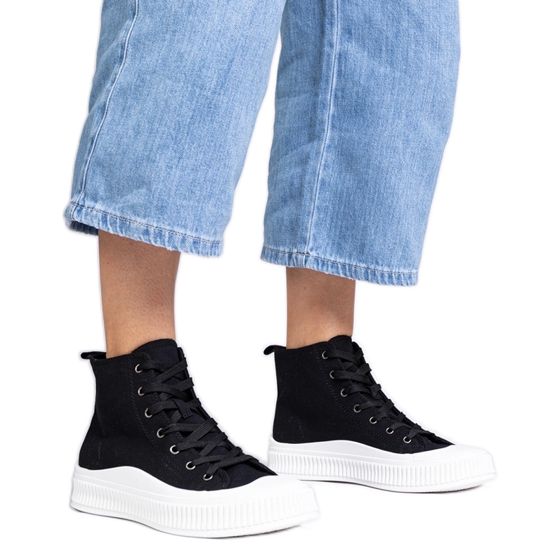 Black high platform sneakers by Guerrino