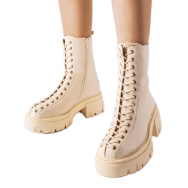 Beige insulated bovver boots decorated with Amla binding