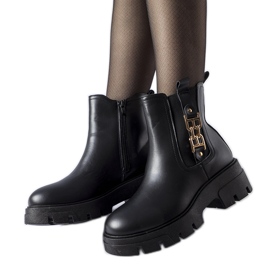 Black massive ankle boots with a decorative Nuovo buckle