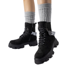 Black ankle boots with a decorative detachable strap