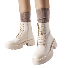 Beige insulated ankle boots with thick sole by Cirillo