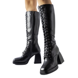 Black insulated boots with a massive Nova heel