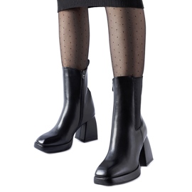 Black insulated ankle boots on a massive Adamo heel