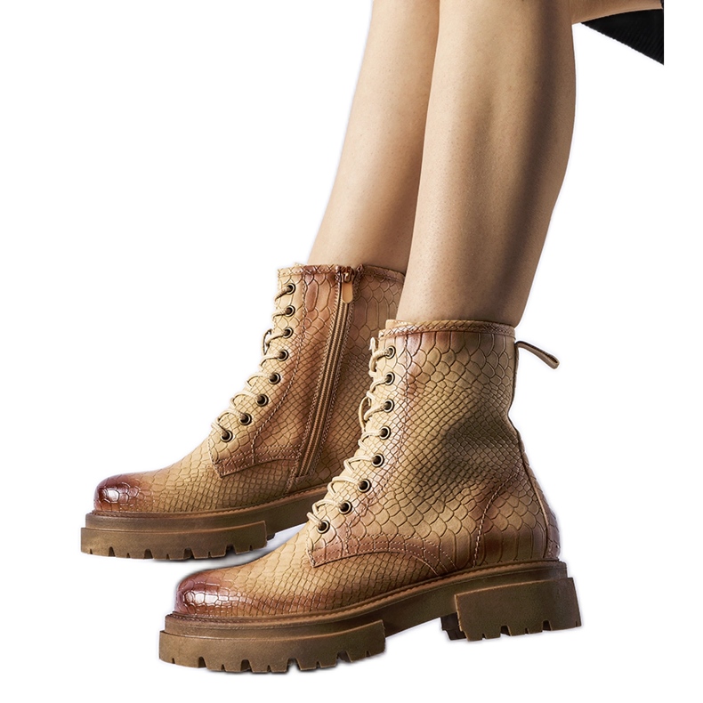 Dark beige animal print boots from Suviana