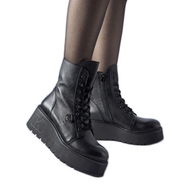 Black leather ankle boots on the Karino platform
