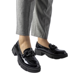 Black patent loafers with a Suelli chain