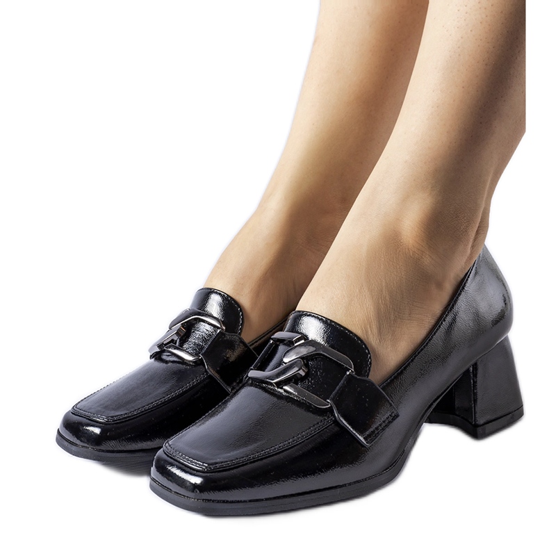 Black patent pumps with a Poiano buckle Black patent pumps with a Poiano buckle