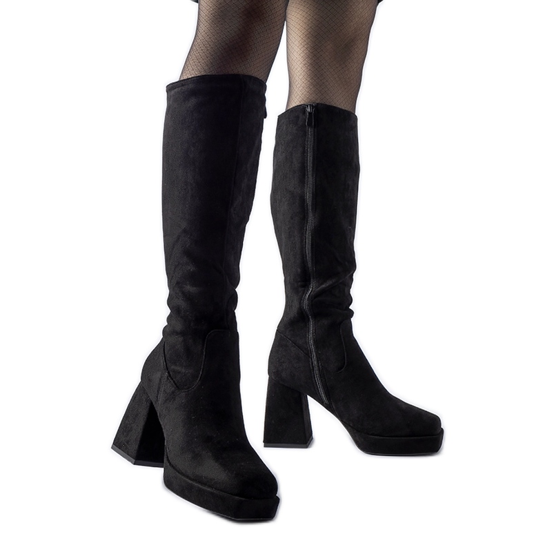 Black warm boots with a massive Fantino heel Black warm boots with a massive Fantino heel