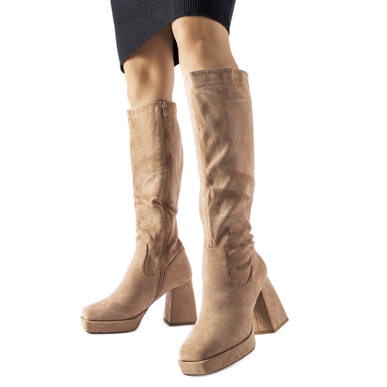 Beige warm boots on a massive Fantino heel