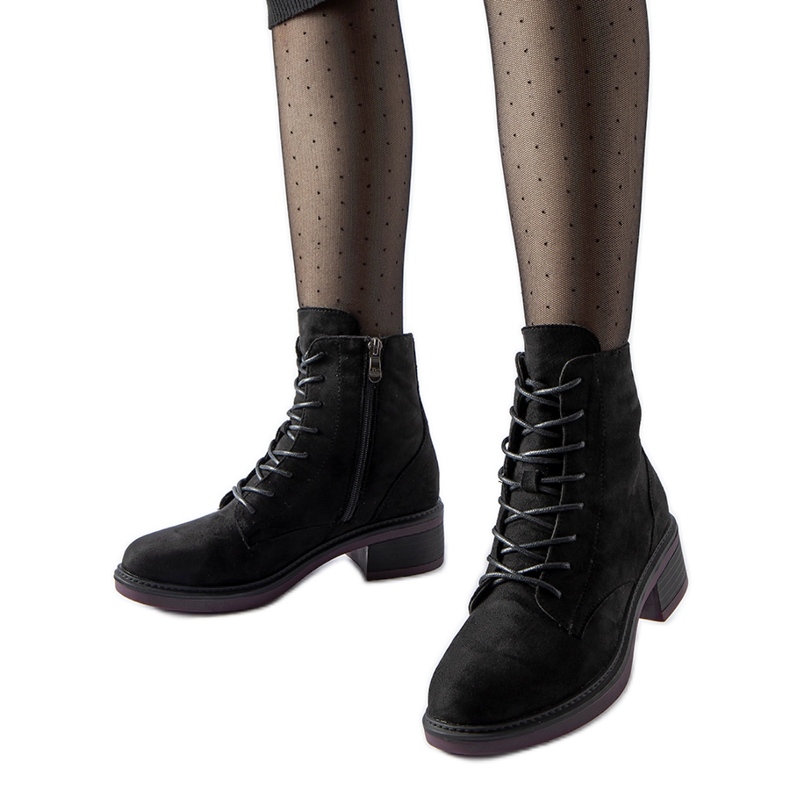 Black classic ankle boots with a purple sole by Teo