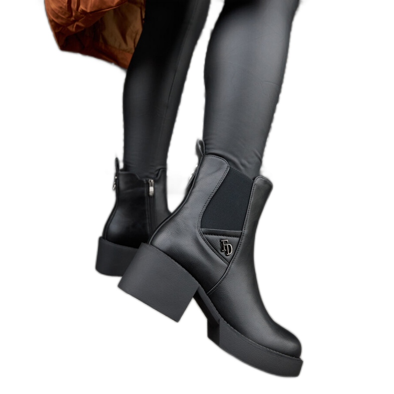 Black insulated ankle boots with an Albert block