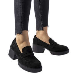 Black moccasins on an eco-suede block by Gaspare Black moccasins on an eco-suede block by Gaspare