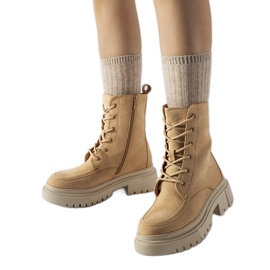 Brown boots with a massive Riel sole