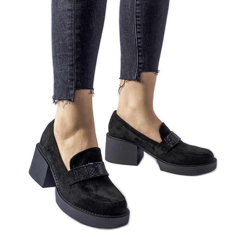 Black shoes with a massive Harrisburg heel