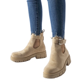 Beige ankle boots with a decorative Sarrazin clasp Beige ankle boots with a decorative Sarrazin clasp