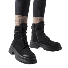 Black Vadnais boots with a worn toe