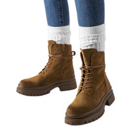 Brown boots with a worn toe from Vadnais