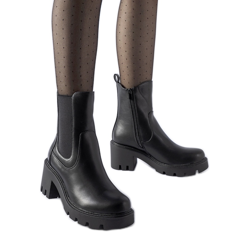 Black insulated boots with a Hattiesburg block