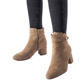 Beige low-heeled ankle boots with a Sesto buckle