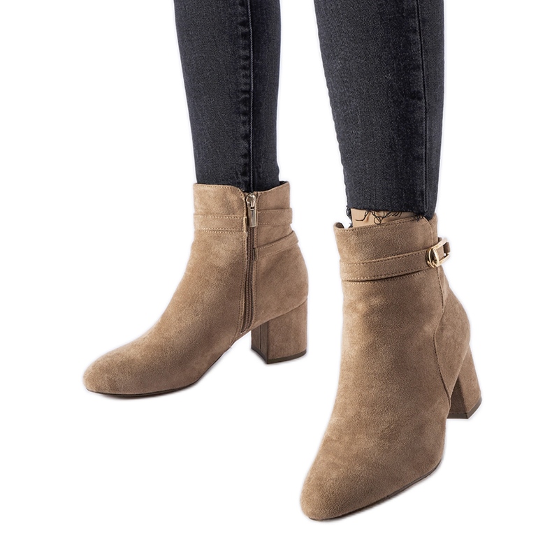 Beige low-heeled ankle boots with a Sesto buckle