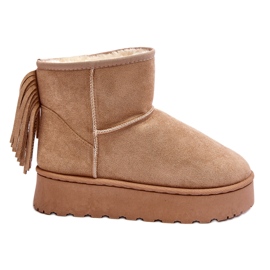Women's snow boots on a massive platform with fringed beige