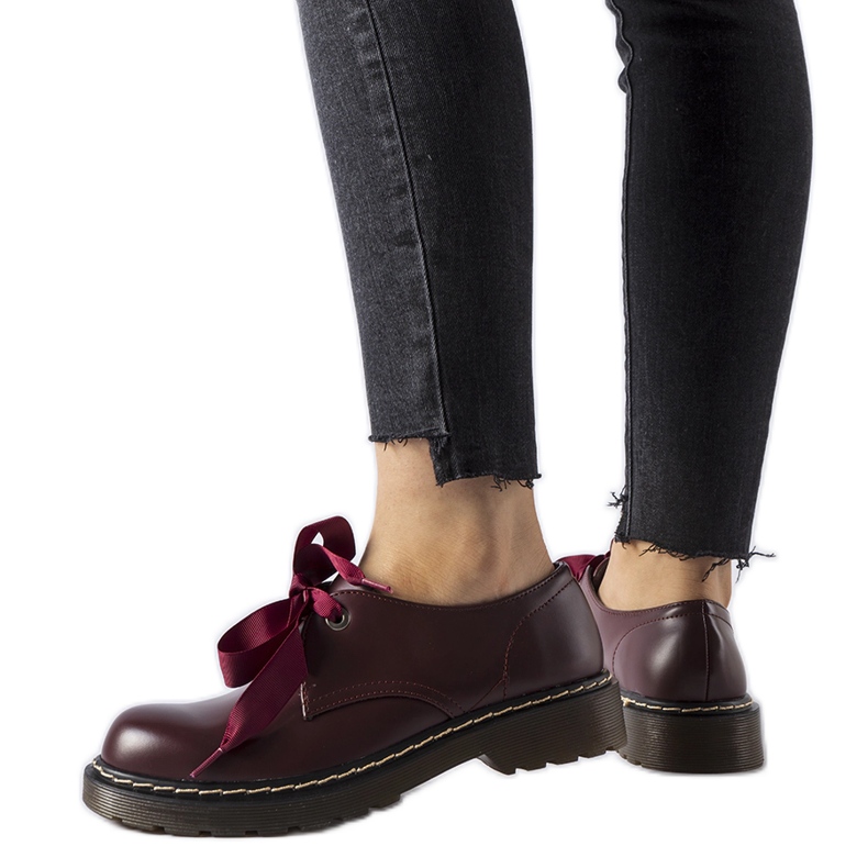 Maroon shoes with a decorative bow from Rodriguez red