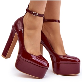 Lacquered pumps on a massive platform and stiletto heel, burgundy Ninames