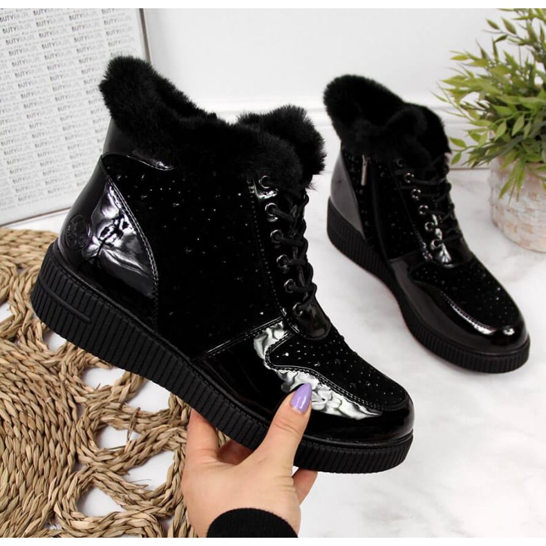 Insulated leather boots on the Rieker W 93312 platform, black