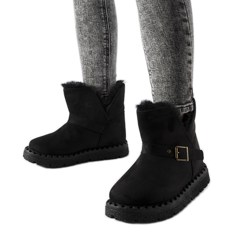 Black insulated snow boots with a Monal cutout