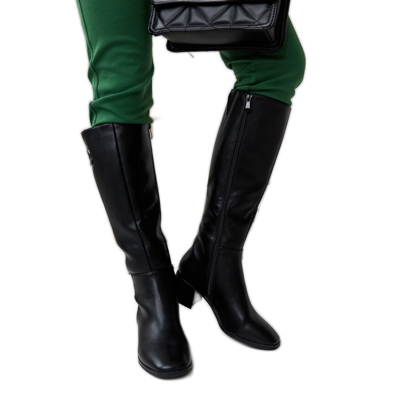 Black boots with a decorative Sydney buckle
