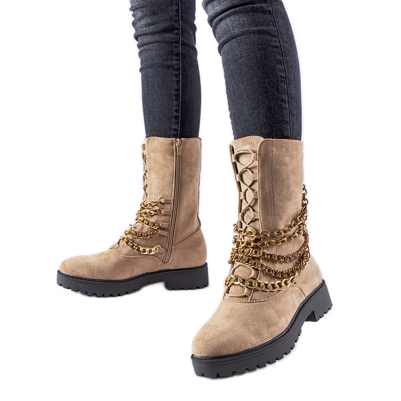 Beige insulated ankle boots with a Carroll chain