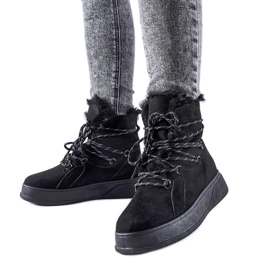 Black snow boots on the Rancourt platform