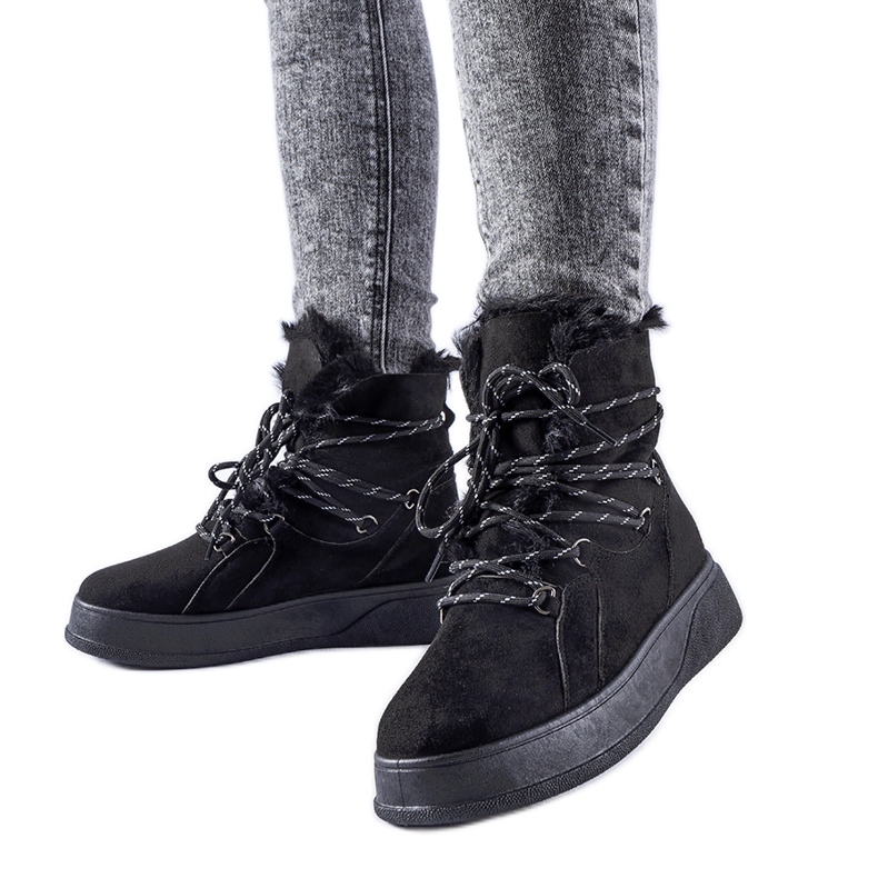 Black snow boots on the Rancourt platform