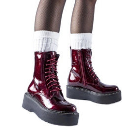 Burgundy patent workers on the Leos platform red