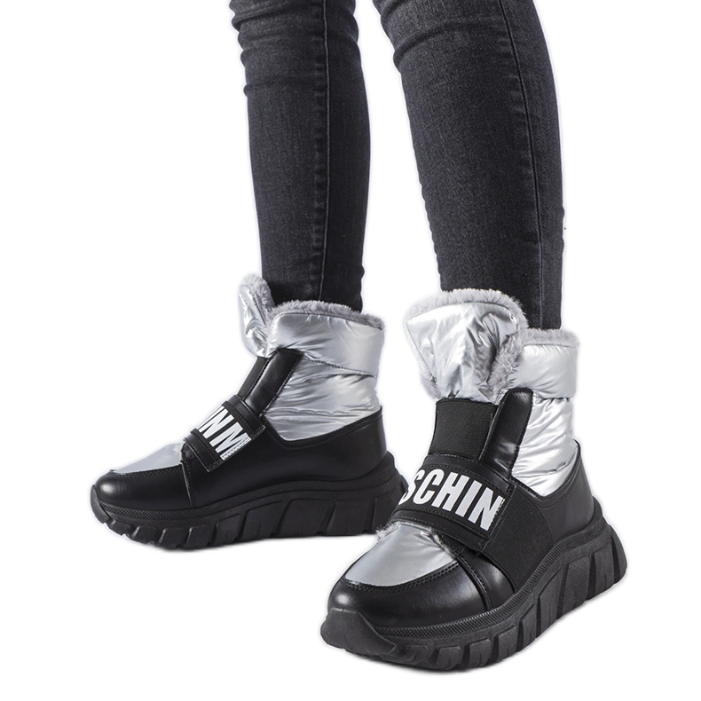 Silver insulated snow boots on the Bend platform